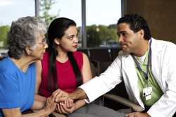 Photo of a cancer patient and her daughter talking to a doctor