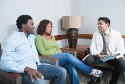 Photo of a man and a woman talking to a doctor