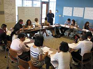 Teachers and CDC Disease Detectives receiving classroom training.