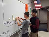 	students working on white board