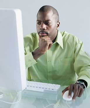 Man reading at the computer.