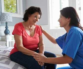 healthcare professional talking to woman