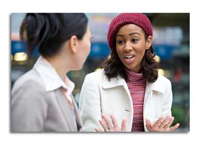 Two women talking.