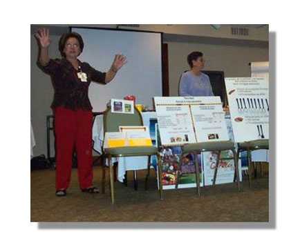 CHWs presenting at a conference.