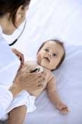 Pediatrician examining a baby