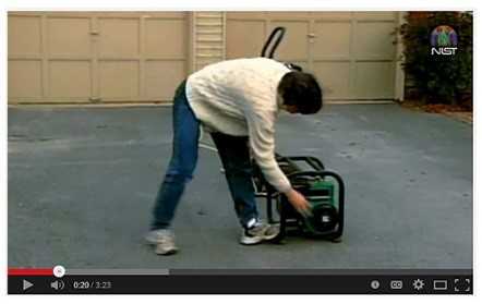 still from video - woman starting outdoor generator