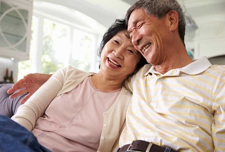 Mature couple laughing