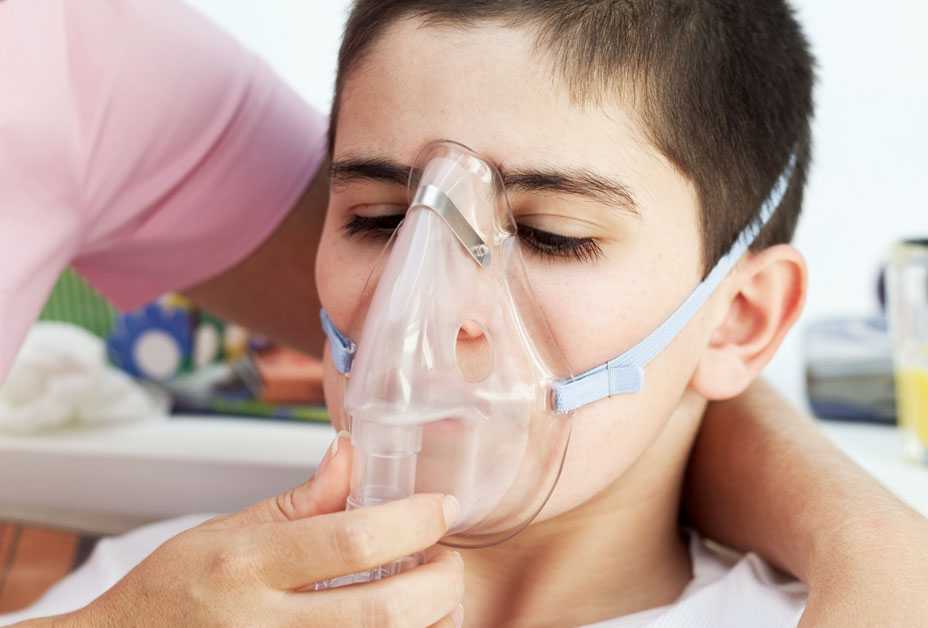 Boy with oxygen mask