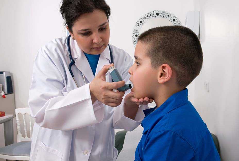 Boy using inhaler