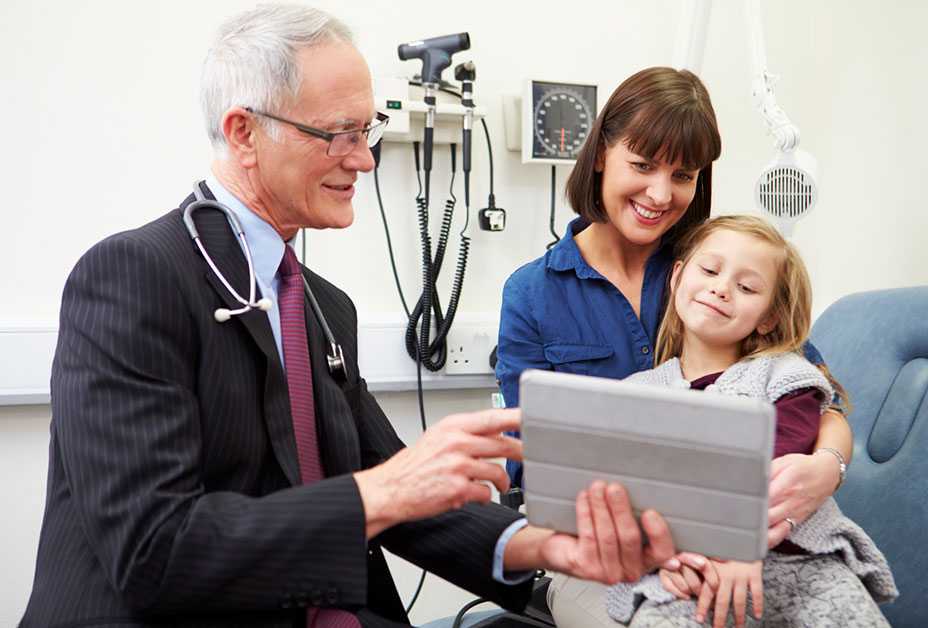 Doctor consulting with mother and daughter