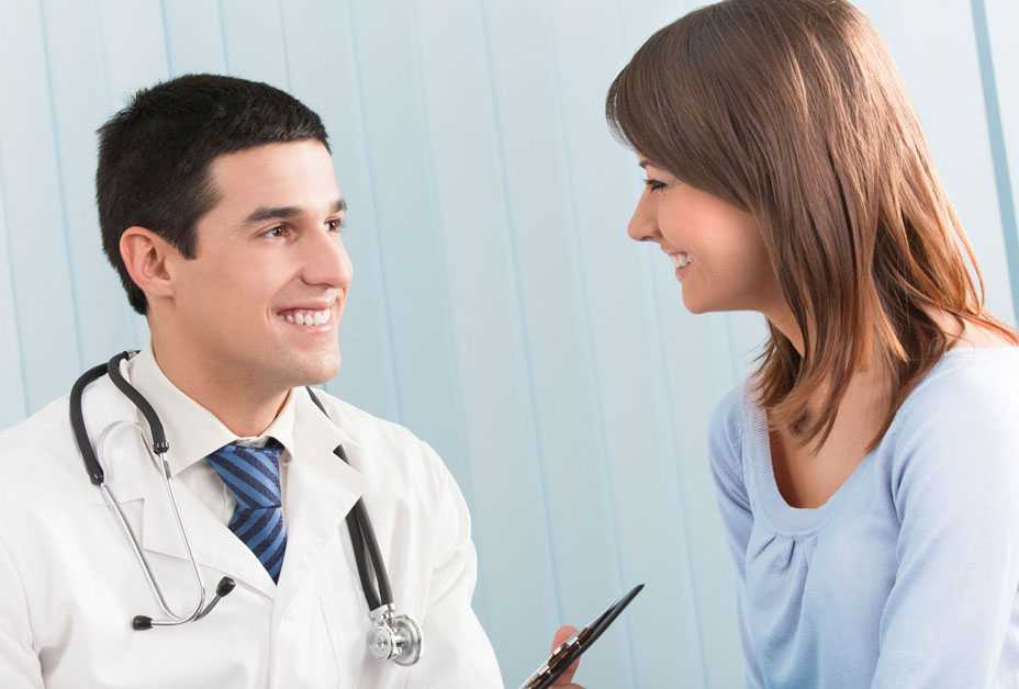 Woman talking to doctor