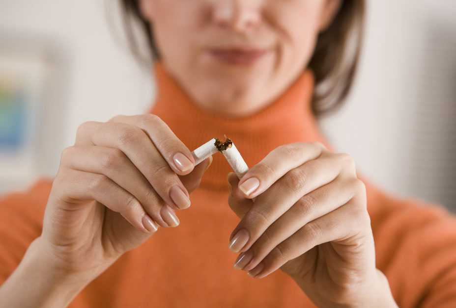 Woman breaking cigarette