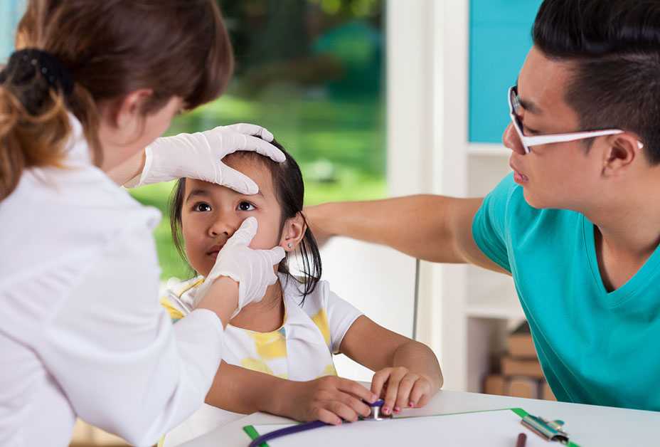 Young girl getting eye exam