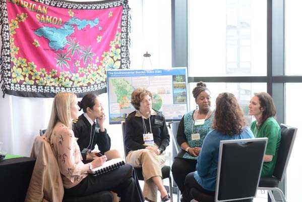 Conference attendees network between sessions