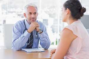 Doctor conferring with patient