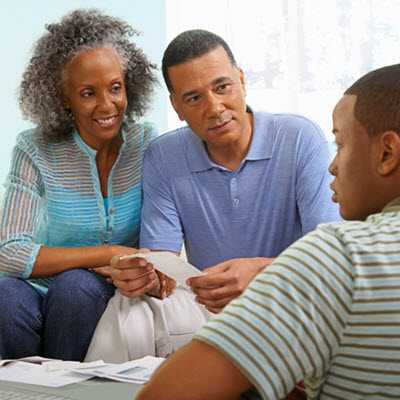 parents talking to an adolescent