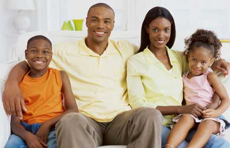 Family sitting on couch