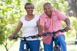 Mature couple riding bicycles