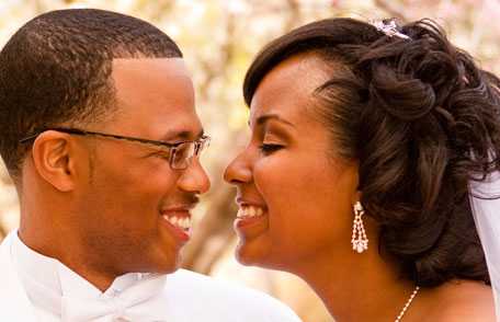 Groom and bride smiling