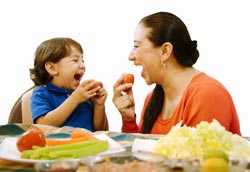 Grandson and grandmother eating apples