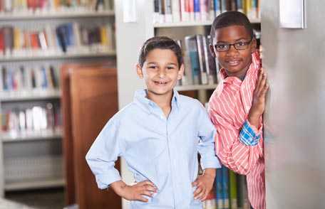 Two boys in school library