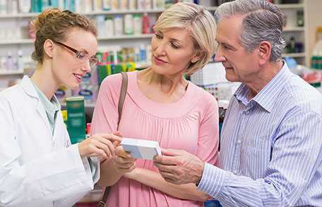 Couple consulting with pharmacist