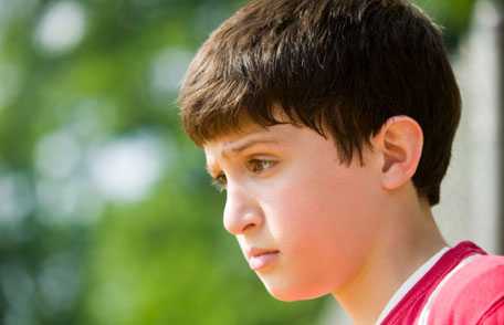 Young boy with serious expression on his face