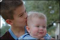 Photo: A boy and his baby brother.