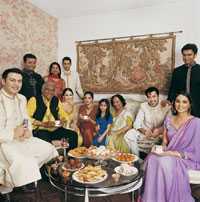 Photo: Large Indian family sitting around table