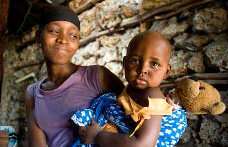 Mother holding daughter