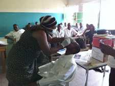 During training, staff at a sentinel site learn the protocol for collecting a respiratory specimen. Democratic Republic of Congo. 