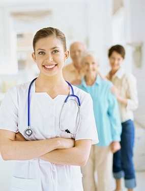 Photo of a female nurse providing care in a long-term care facility.