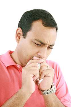 A man coughing