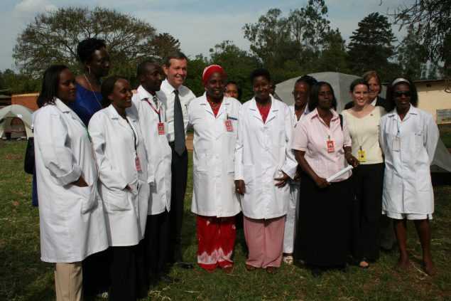 Secretary Leavitt poses for a photo with MVCT project staff