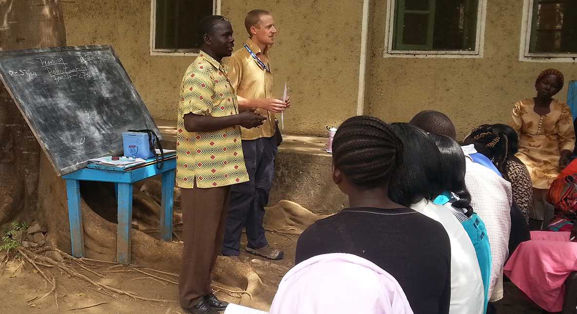 STOP Consultants Melis and d’Arcy speaking with mothers and social mobilizers