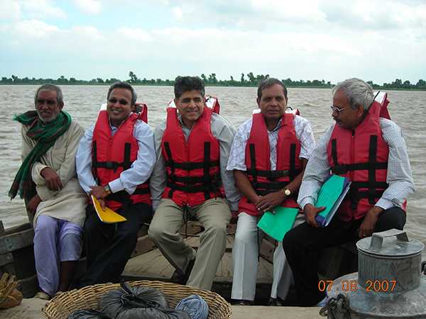 In Bihar, India, Dr. Hamid Jafari, CDC Principal Director for the Center of Global Health, crosses a swollen Ganges river to monitor a mass vaccination campaign.