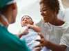 Doctor with patient and new baby