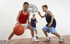 Boys playing basketball