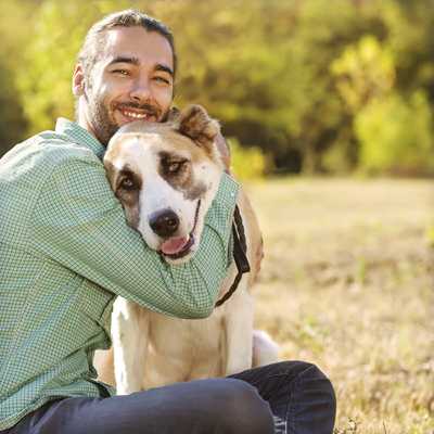 Man hugging a dog