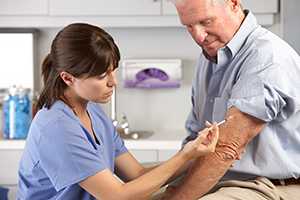 A man receives his annual influenza vaccine