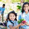 2 girls holding vegetables