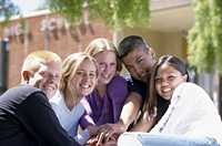 teens in front of school building