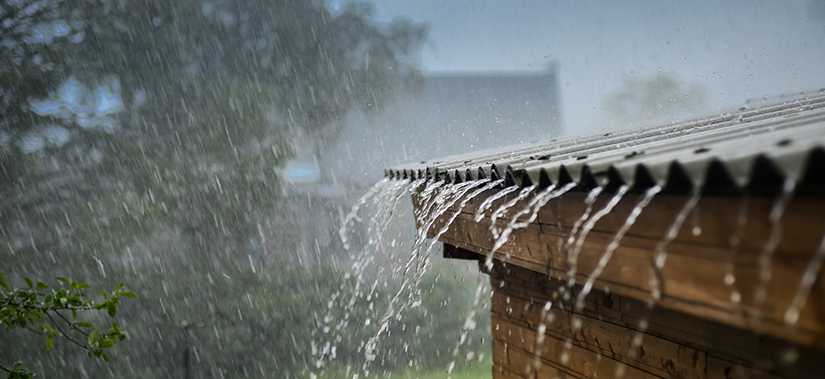 rain pouring off a metal roof