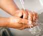 washing hands under sink