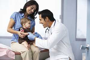 Doctor with mom and child