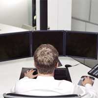 Image of a man in front of computer