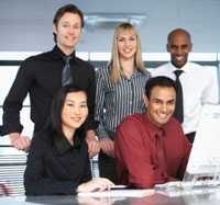 image of a group of office workers around a computer