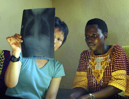 Woman showing patient chest x-ray