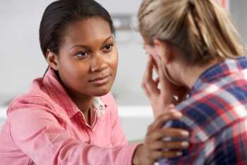 image of two women talking