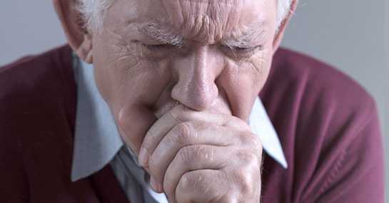 Elderly man coughing